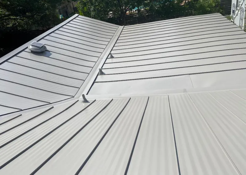 Solar attic fan installed on a metal roof for Roof Ventilation in Glendale